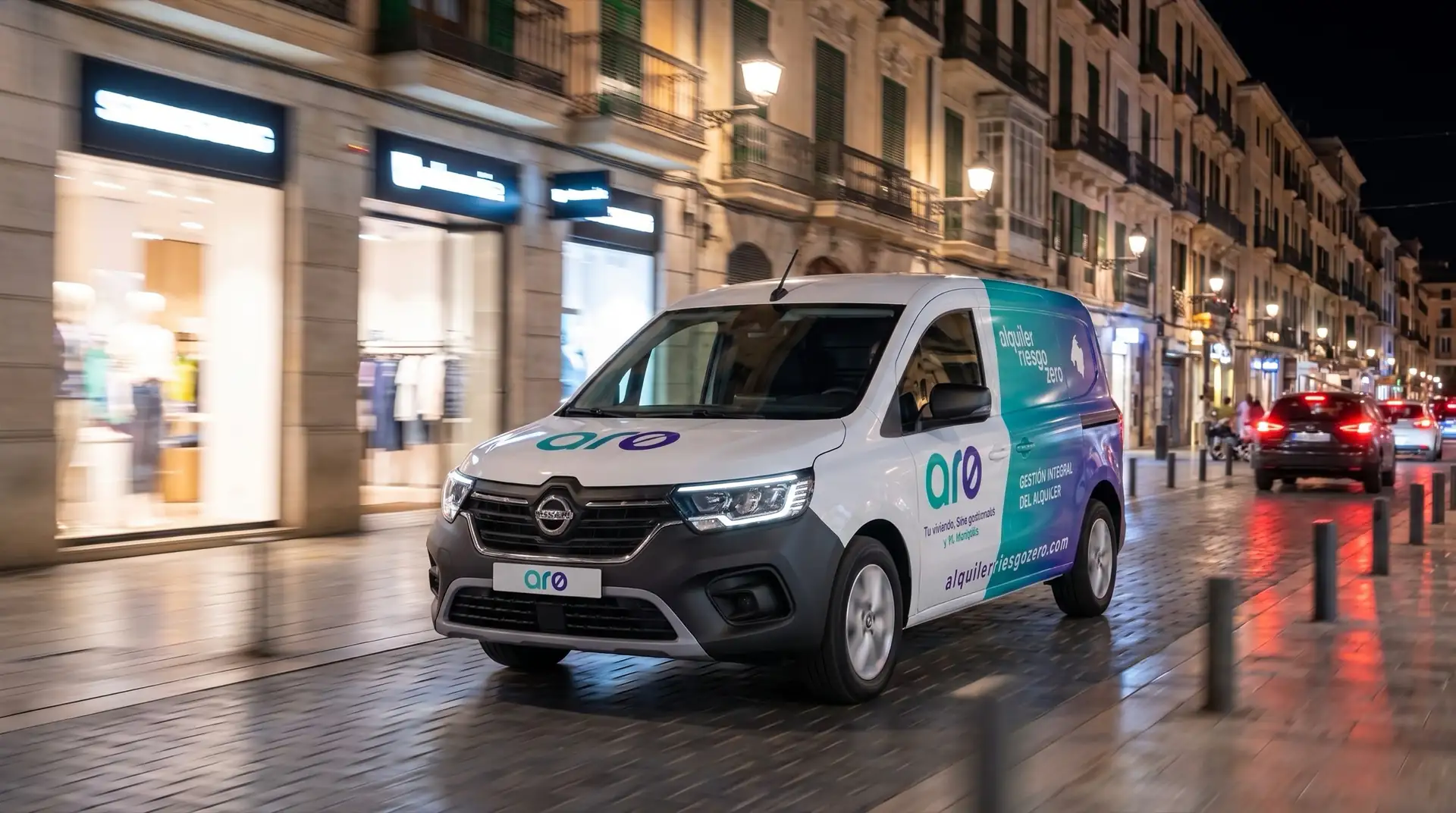 An Alquiler Riesgo Zero van driving through Palma at night